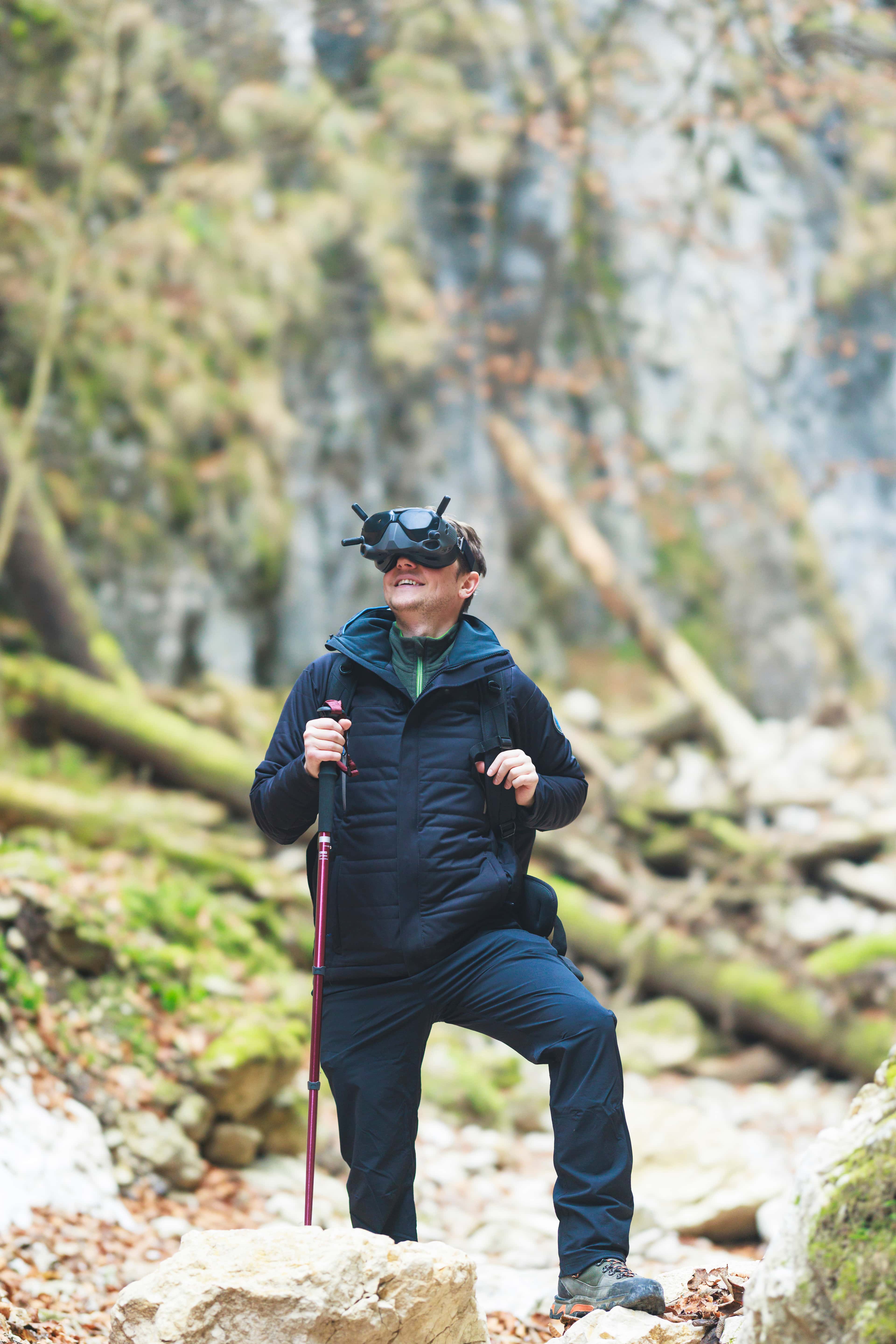 Virtual traveler, traveling in universes from metaverse or multiverse using VR glasses, cyber hiking the new trend among mountain tourists. A trip in nature in multiverse with virtual reality glasses