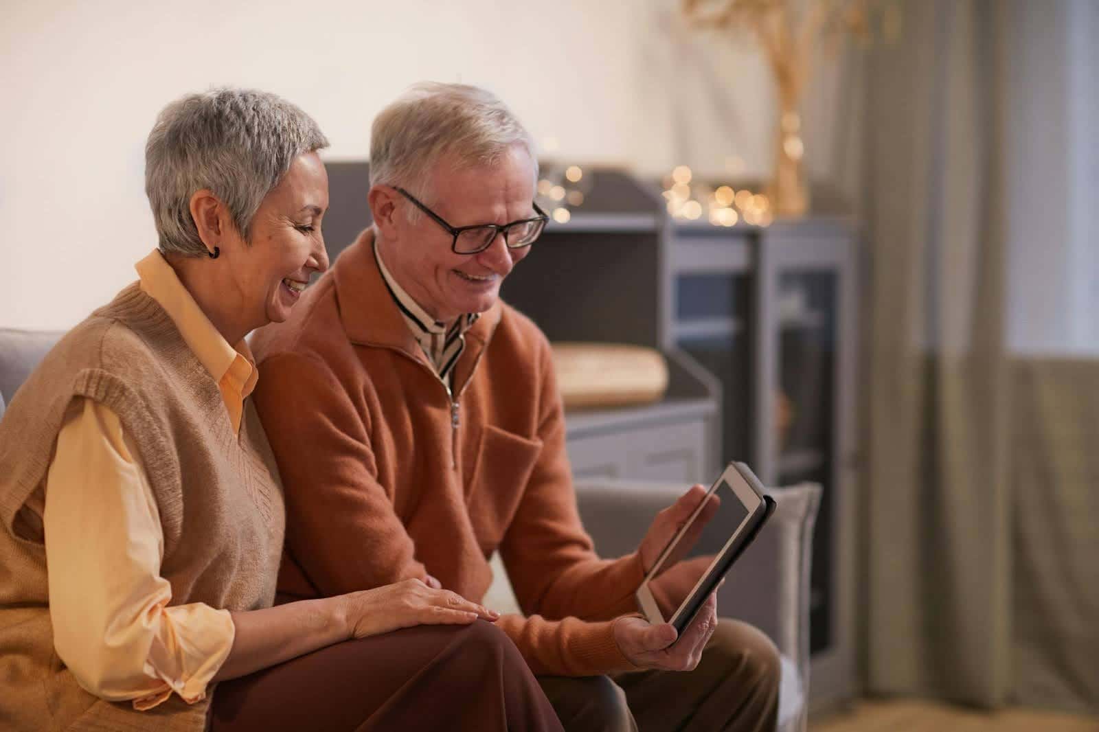 Two Elderly People enjoying their tour on an tablet